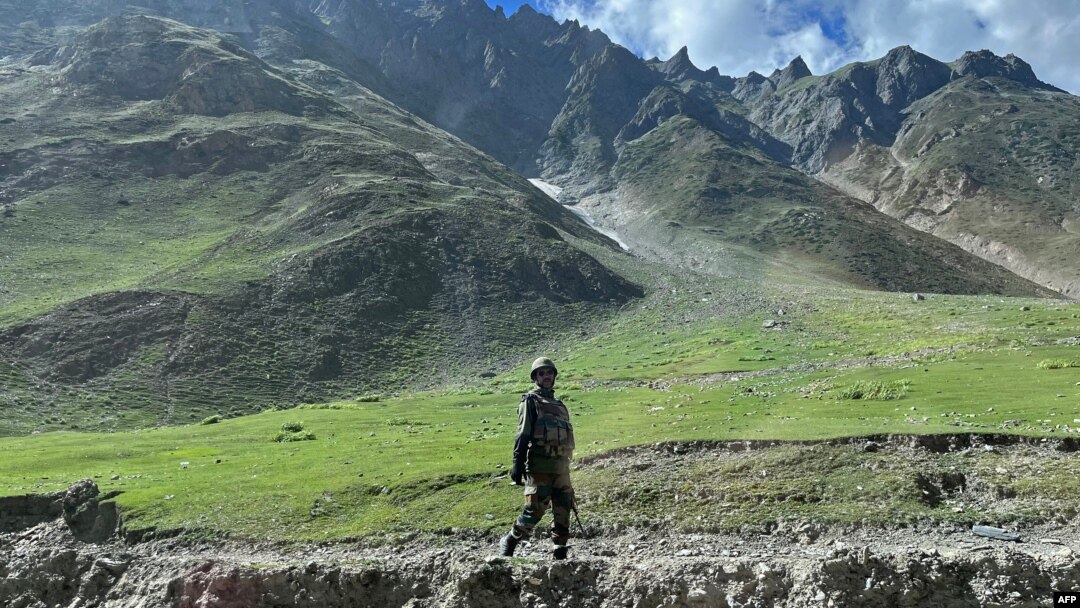 FILE - An Indian army soldier stands guard at Zoji La pass in Kargil, connecting Srinagar and the federal territory of Ladakh bordering China, Aug. 29, 2023.