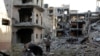 As Guns Fall Silent, Benghazi Residents Return to Battered Homes