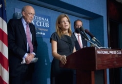 FILE - Maya MacGuineas, president of the Committee for a Responsible Federal Budget, center, speaks during a news conference on deficit reduction at the National Press Club in Washington, Sept. 12, 2011.