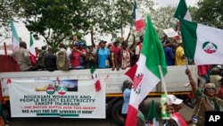 FILE—People protest against the recent increase in the electricity tariff, in Abuja Nigeria, May 13, 2024.