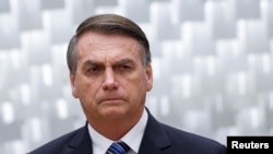 Brazil's President Jair Bolsonaro attends an inauguration ceremony for new judges of Brazil's Superior Court of Justice in Brasilia