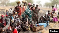 FILE - Women and children wait to be treated at a Medecins Sans Frontieres (MSF) support clinic in Thaker, Southern Unity, South Sudan, March 20, 2017. 