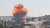 A fireball erupts from the site of an explosion reportedly targeting a joint Turkis-Russian patrol on the strategic M4 highway, near the Syrian town of Ariha in the rebel-held northwestern Idlib province.