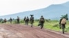FILE — M23 rebels prepare to leave after a ceremony to mark the withdrawal from their positions in eastern Democratic Republic of Congo, on December 23, 2022. 
