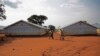 Refugees walk at the Nyumanzi transit center in Adjumani, Uganda, on July 13, 2016. 