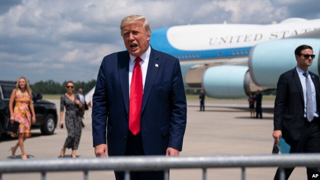 President Donald Trump talks to a crowd of supporters after arriving at Wilmington International Airport, Sept. 2, 2020, in Wilmington, N.C.