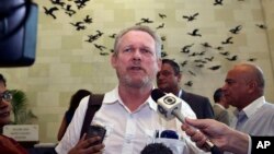 FILE - South African Minister for Trade and Industry Rob Davies talks to the press.