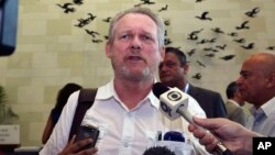 FILE - South African Minister for Trade and Industry Rob Davies talks to the press.