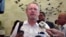 FILE - South African Minister for Trade and Industry Rob Davies talks to the press.