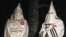 FILE - Two Ku Klux Klansmen take part in an interview near Pelham, North Carolina, Dec. 2, 2016. Glendon Crawford, sentenced to 30 years in prison, Dec. 19, 2016, for trying to build a bomb, was described as a self-professed member. 