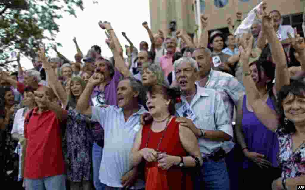 Relatives of victims killed during Argentina's dirty war celebrate the verdict at the end of the trial for former dictator Jorge Videla in Cordoba, Argentina, Wednesday Dec. 22, 2010. Videla was sentenced to life in prison Wednesday for the torture and mu