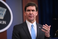 FILE - U.S. Defense Secretary Mark Esper addresses reporters during a media briefing at the Pentagon in Arlington, Va., Oct. 11, 2019.