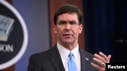 U.S. Defense Secretary Mark Esper addresses reporters during a media briefing at the Pentagon in Arlington, Va., Oct. 11, 2019.