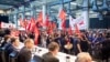 Employees protest before the start of a works meeting in a hall at the VW plant in Wolfsburg, Sept. 4, 2024. Volkswagen has announced that it will tighten its austerity measures due to the tense situation of the core brand.