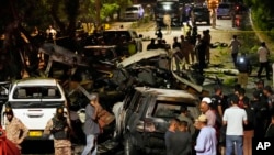 FILE - Security officials work on the site of an explosion outside Karachi airport, Pakistan, Oct. 7, 2024. The attack, claimed by Pakistani Baloch separatists killed two Chinese nationals.