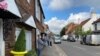 In England's picture-postcard Berkshire village of Cookham, along the River Thames, the locals appeared to be observing the mask rule. “We are a well-behaved lot around here,” said Sandy, a barista at Mr. Cooper's Coffee House. (Jamie Dettmer/VOA)