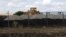 An excavator is seen at a construction site for Russia's new military base near the Russian-Ukrainian border in the village of Soloti, southeast of Belgorod, Russia, September 7, 2015.