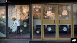 A worker sweeps inside a branch of the North Korean-operated restaurant in Beijing. China has said it has ordered North Korean businesses in China to close by early 2018.