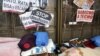 People sleep outside the headquarters of Spanish nationalized lender Bankia, where protesters have camped for more than three weeks, in Madrid, November 20, 2012.