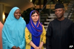 Nigerian activist Amina Yusuf, left, Pakistani activist Malala Yousafzai and acting Nigerian President Yemi Osinbajo are pictured at the presidential villa, in Abuja, July. 17, 2017.