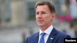 Britain's Secretary of State for Health and Social Care Jeremy Hunt arrives at the BBC in central London, Britain, July 9, 2018. 