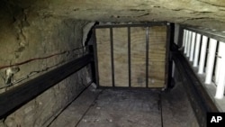 FILE - Undated image provided by US Department of Justice, shows elevator inside tunnel stretching from Mexico to San Diego.