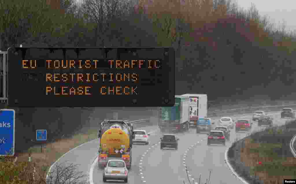 A motorway sign warning drivers about EU traffic restrictions is seen on the M56 motorway near Liverpool, Britain.