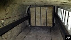 FILE - Undated image provided by US Department of Justice, shows elevator inside tunnel stretching from Mexico to San Diego.