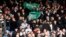 FILE - Crystal Palace fans mock the opposing team with flags of Saudi Arabia before a match between Crystal Palace and Newcastle United, in Selhurst Park, London, Oct. 23, 2021. (Action Images via Reuters)