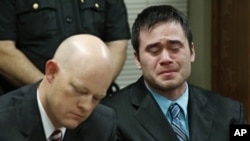 Daniel Holtzclaw, right, cries as the verdicts are read in his trial in Oklahoma City, Dec. 10, 2015. A 