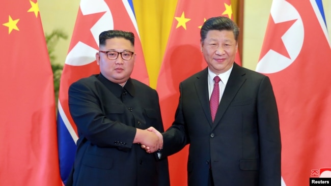 中国国家主席习近平在北京会见朝鲜领导人金正恩（路透社）