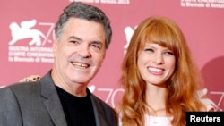 Director Amos Gitai (L) poses with actress Yuval Scharf during a photocall for the movie "Ana Arabia" during the 70th Venice Film Festival in Venice Sept. 3, 2013. 