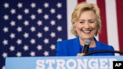 FILE - Democratic presidential candidate Hillary Clinton pauses while speaking at a rally at Johnson C. Smith University, in Charlotte, N.C., Sept. 8, 2016.