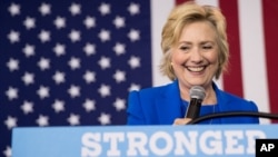 FILE - Democratic presidential candidate Hillary Clinton pauses while speaking at a rally at Johnson C. Smith University, in Charlotte, N.C., Sept. 8, 2016.