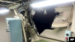 This photo provided by the Philippine Coast Guard, shows damage in the auxiliary room on the port side near the port auxiliary engine of Philippines coast guard vessel BRP Bagacay after a collision with a Chinese ship Aug. 19, 2024 in the disputed South China Sea. 