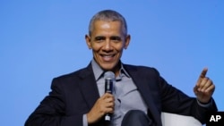 FILE - Former U.S. President Barack Obama gesture as he attends the "values-based leadership" during a plenary session of the Gathering of Rising Leaders in the Asia Pacific, organized by the Obama Foundation in Kuala Lumpur, Malaysia, Dec. 13, 2019.