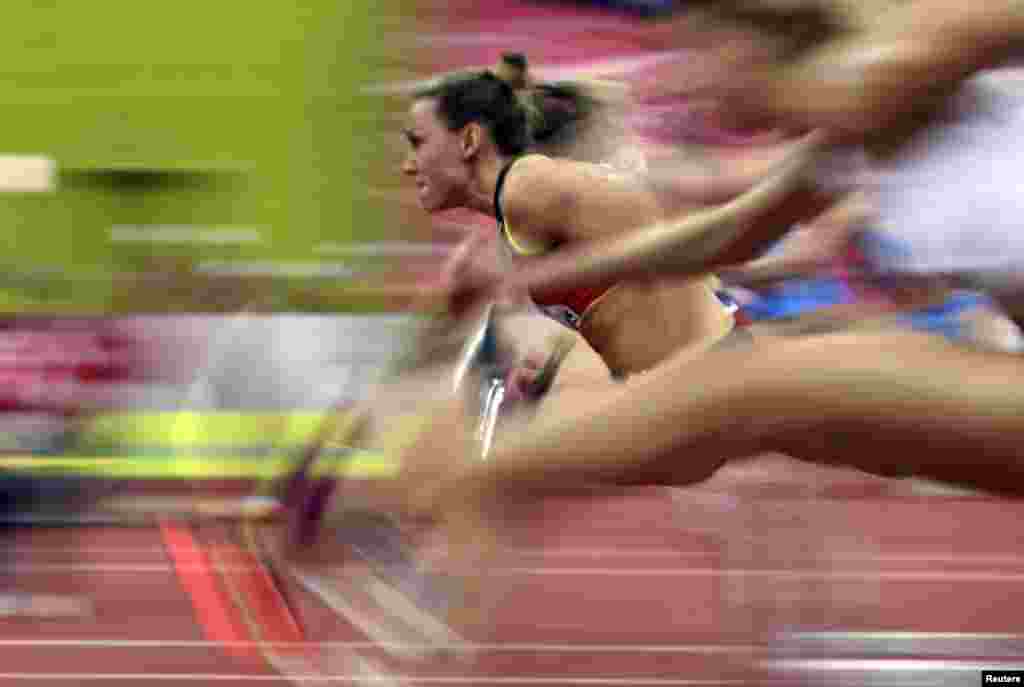 Athletes compete in the women&#39;s 60m hurdles semifinals during the IAAF European Indoor Championships in Prague, Czech Republic.