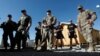 U.S. troops listen to a security briefing before leave their base in Logar province, Afghanistan, Aug. 5, 2018.