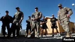 U.S. troops listen to a security briefing before leave their base in Logar province, Afghanistan, Aug. 5, 2018.