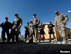 FILE - U.S. troops listen to a security briefing before leave their base in Logar province, Afghanistan, Aug. 5, 2018.
