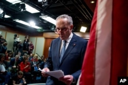FILE - Senate Minority Leader Sen. Chuck Schumer of N.Y. leaves after speaking at a news conference, Dec. 16, 2019, on Capitol Hill in Washington.