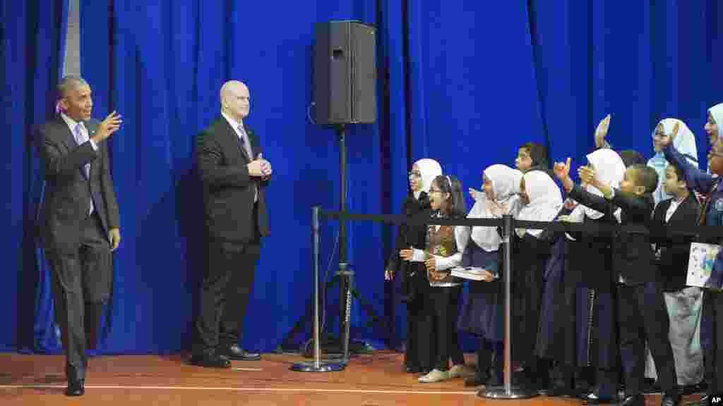 Children from Al-Rahmah school react to seeing President Barack Obama, who came over to greet them during his visit to the Islamic Society of Baltimore, Feb. 3, 2016.