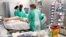 Staff treat a patient in the intensive care unit at the University Hospital (CHUV) during the coronavirus disease (COVID-19) outbreak in Lausanne, Switzerland, April 3, 2020. 