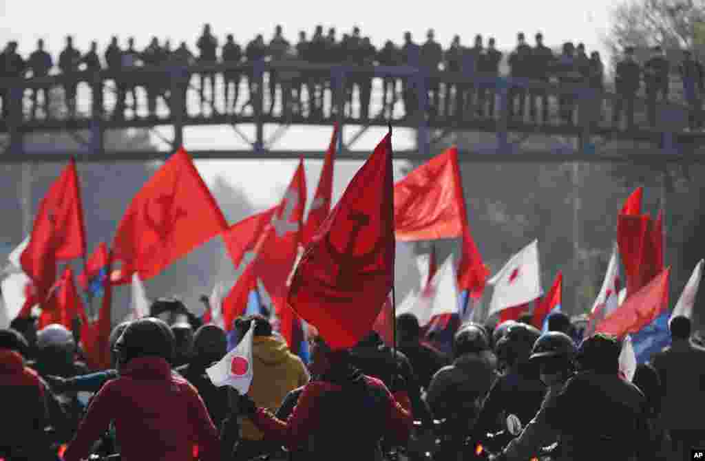 Nepalese supporters of the splinter group in the governing Nepal Communist Party take part in a protest in Kathmandu.