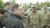 U.S. Special Representative for Ukraine Negotiations Kurt Volker, third from left, meets with Ukrainian troops at an undisclosed location near Popasna, Donbas region, Ukraine, May 15, 2018. (M. Gongadze/VOA)