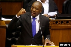 FILE - Opposition Democratic Alliance (DA) party leader Mmusi Maimane speaks during the motion of no confidence against South African president Jacob Zuma in parliament in Cape Town, South Africa, Aug. 8, 2017.