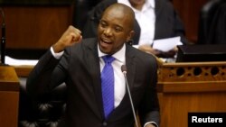 FILE - Opposition Democratic Alliance (DA) party leader Mmusi Maimane speaks during the motion of no confidence against then-President Jacob Zuma in parliament in Cape Town, South Africa, Aug. 8, 2017.