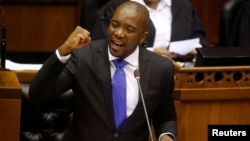 FILE - Opposition Democratic Alliance (DA) party leader Mmusi Maimane speaks during the motion of no confidence against South African president Jacob Zuma in parliament in Cape Town, South Africa, Aug. 8, 2017.