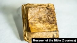 This undated photo shows the Afghan Liturgical Quire on display at the Museum of the Bible in Washington. The manuscript has been carbon-dated to the 8th century, making it the oldest-known Hebrew book.