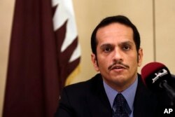 FILE - Qatari Foreign Minister Sheikh Mohammed bin Abdulrahman Al Thani, talks to journalists during a press conference in Rome, July 1, 2017.